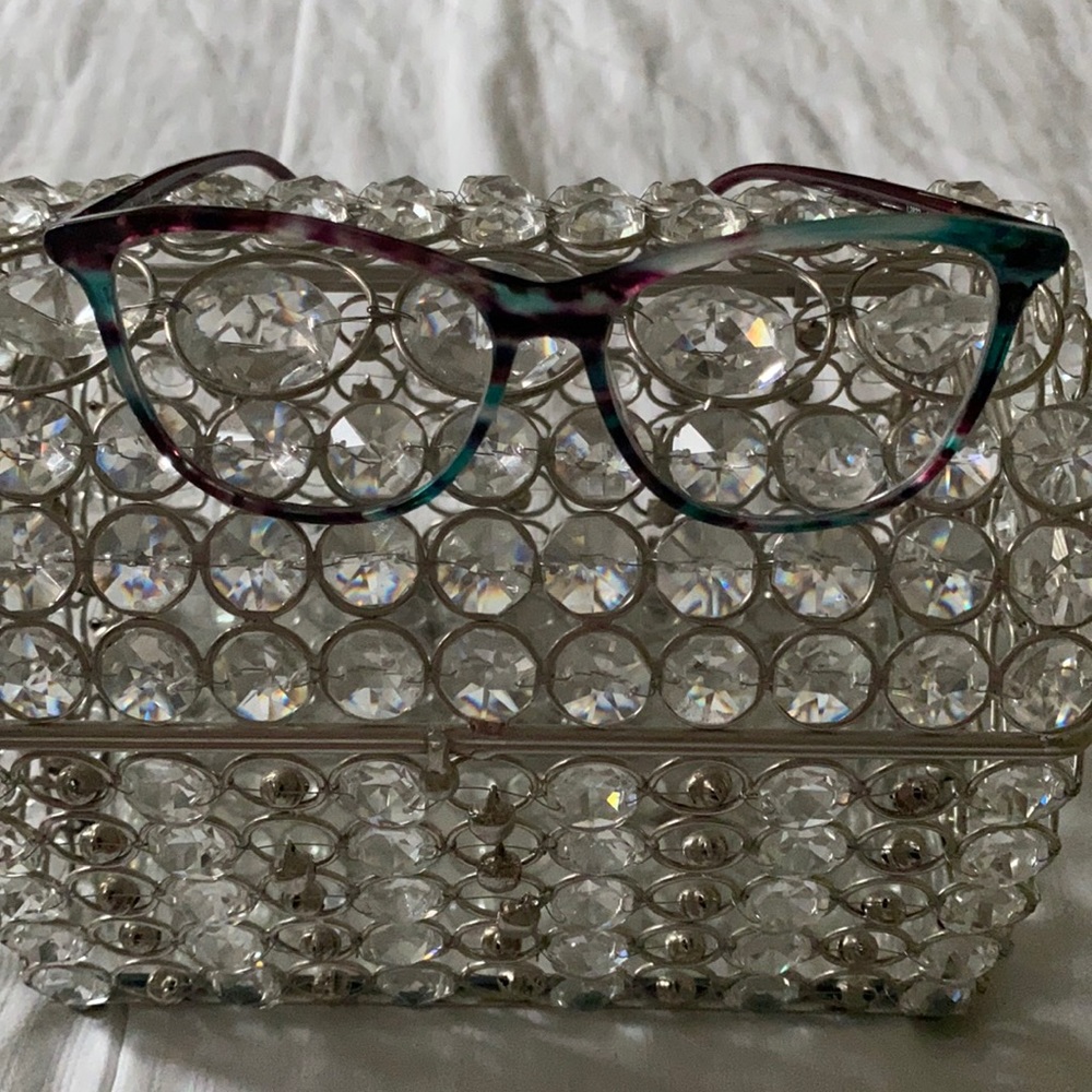 Frames slight prescription lens OD -0.50 OS -0.75.